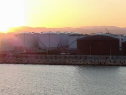 Ship leaving Barcelona harbor at sunset, Spain Stock Footage