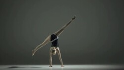 HD Super Slow-Mo: Rhythmic Gymnast Doing A Cartwheel Stock Footage