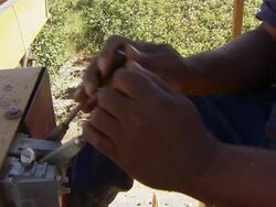 CU of farmer operating levers on machine. Stock Footage