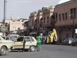 WS View of people walking and vehicles moving on street / Marrakesh, Morocco Stock Footage