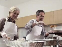 People serving meal in soup kitchen Stock Footage
