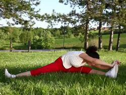 Young Woman doing stretching exercise Stock Footage