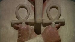An ancient Egyptian carving depicts two hands holding ankhs. Stock Footage