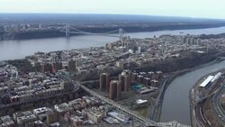 New York city aerial landscape: Harlem and Washington Heights with the George Washington Bridge. Stock Footage