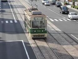 MS Tram running on road in Hiroshima / Hiroshima, Japan Stock Footage