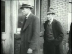 A group of men walk in a long unemployment line. News Clip