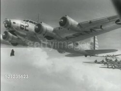 MOT 1939: NEW HEAVY BOMBERS: WS Line of B-17 'Flying Fortress' aircraft turning left out of line & taxiing forward (#10 FG) wing moving ABOVE position on runway. AERIAL B-17 (#62 w/ 'Army' under wing) in flight, other in flight BG MS NEXT TO B-17 propeller Instructional Video