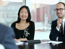 MS DS R/F three coworkers in discussion at conference room table/Seattle, Washington, USA  Stock Footage