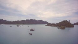 Fishing boats moored by their village in the Burmese archipelago Stock Footage