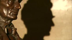 Bronze bust of Abraham Lincolon with shadow on wall behind Stock Footage