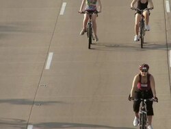 WS Bike traffic on Lake Shore Drive in Chicago on summer morning during community cycling event / Chicago, Illinois, USA Stock Footage