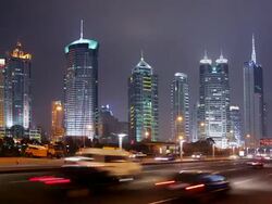 Time lapse long shot traffic on Lujiazui Road at night/ view of skyscrapers in Pudong financial district/ Shanghai Stock Footage