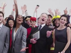 Diverse crowd with different careers raising arms cheering Stock Footage