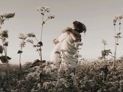 HD SLOW-MOTION: Loving Couple Twirling In Buckwheat Field Stock Footage