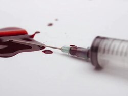 Dirty Syringe Falling Into Blood Stock Footage