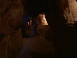 Point of view shot entering the tunnels inside an Egyptian pyramid Stock Footage