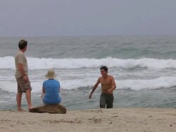 MS TS Couple and young man by seaside / Tyrona N. Park, Magdalena, Colombia  Stock Footage
