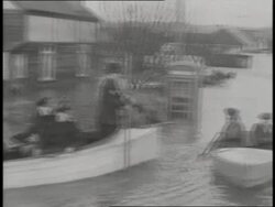 Police officers help in search and rescue efforts during the North Sea storms and floods in England. News Clip
