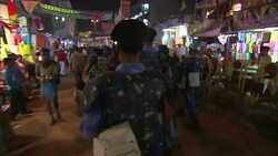 Armed riot police patrol the streets during a Diwali celebration in India. Stock Footage