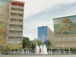 Children plaing in fountain,Murs Peints Les Cities Ideales,Ideal City Murals in the Etats Unis area of Lyons,Zi Stock Footage