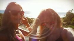 Surfer girls taking a selfie Stock Footage