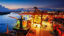 Cargo ship in the harbor at sunset . Stock Footage