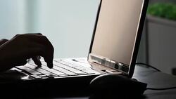 Close up of a hand typing on laptop keyboard Stock Footage