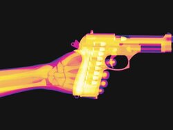 X-ray of a hand raising a pistol and firing Stock Footage