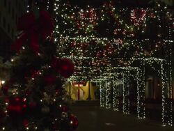 Christmas tree by lighted passage at Christmas by Harrahs Hotel in New Orleans Stock Footage