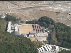 Aerial views of tsunami-battered Japanese seaside communities showed an eerie flattened moonscape on Friday, eight months after Japan's March 11 disaster. News Clip