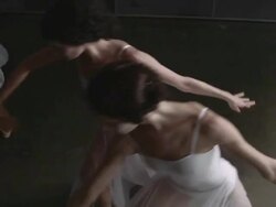 Three ballerinas performing arabesque Stock Footage