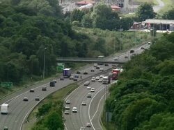 Aerial medium shot over traffic on M2 motorway / Kent, England Stock Footage