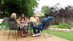 MS Laughing group of friends dining together at table in backyard on summer evening Stock Footage