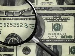 Examining the dollar bill with a magnifying glass, president winks Stock Footage