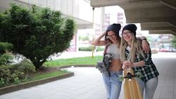 Careless girlfriends laughing at the park Stock Footage