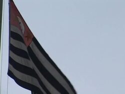 CU, LA, Brazil, Sao Paulo, City flag fluttering against clear sky Stock Footage