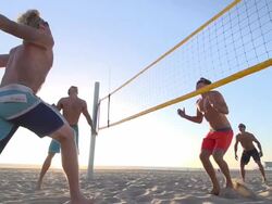 Men playing beach volleyball. - Slow Motion - filmed at 240 fps Stock Footage