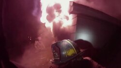 Slow Motion firefighter POV on burning roof Stock Footage