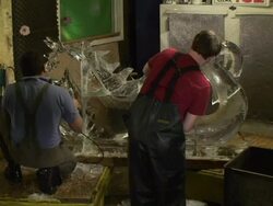 Artists carve a dragon-horse ice sculpture. Stock Footage