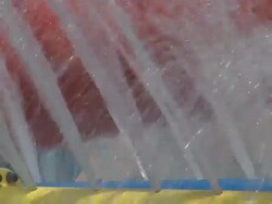 Jets and sprays; water games attraction in a colored waterpark Stock Footage