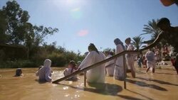 Baptismal ceremony at Qasr el Yahud baptism site in the Jordan River Valley, Israel Stock Footage