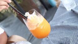 Woman stir her juice Stock Footage