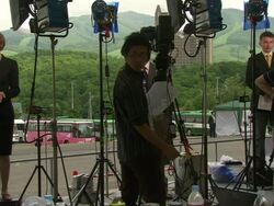 MS Shot of television news crews working outside during G8 meeting / Hokkaido Toyako, Japan Stock Footage