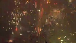 Fireworks shoot out sparks at a Chinese New Year celebration. Stock Footage