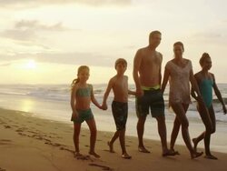Family on a tropical beach vacation to Hawaii Stock Footage