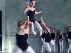 WS TU Young ballerina dancer girl in ballet trapeze being spun around by two other ballerinas / Rancho Mirage, California, United States  Stock Footage