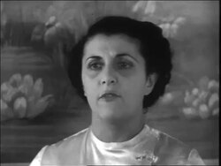 B/W 1938 close up brunette beautician speaking indoors / newsreel Stock Footage