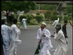 Government supporters and opponents turned  Pakistan's largest city into a battleground Saturday,  gunfire ahead of rival political rallies  left at least 27 people dead. Instructional Video