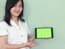 Collegian typing on digtal table,Green screen Stock Footage