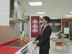 POV TS salesman showing kitchen furniture in showroom Stock Footage